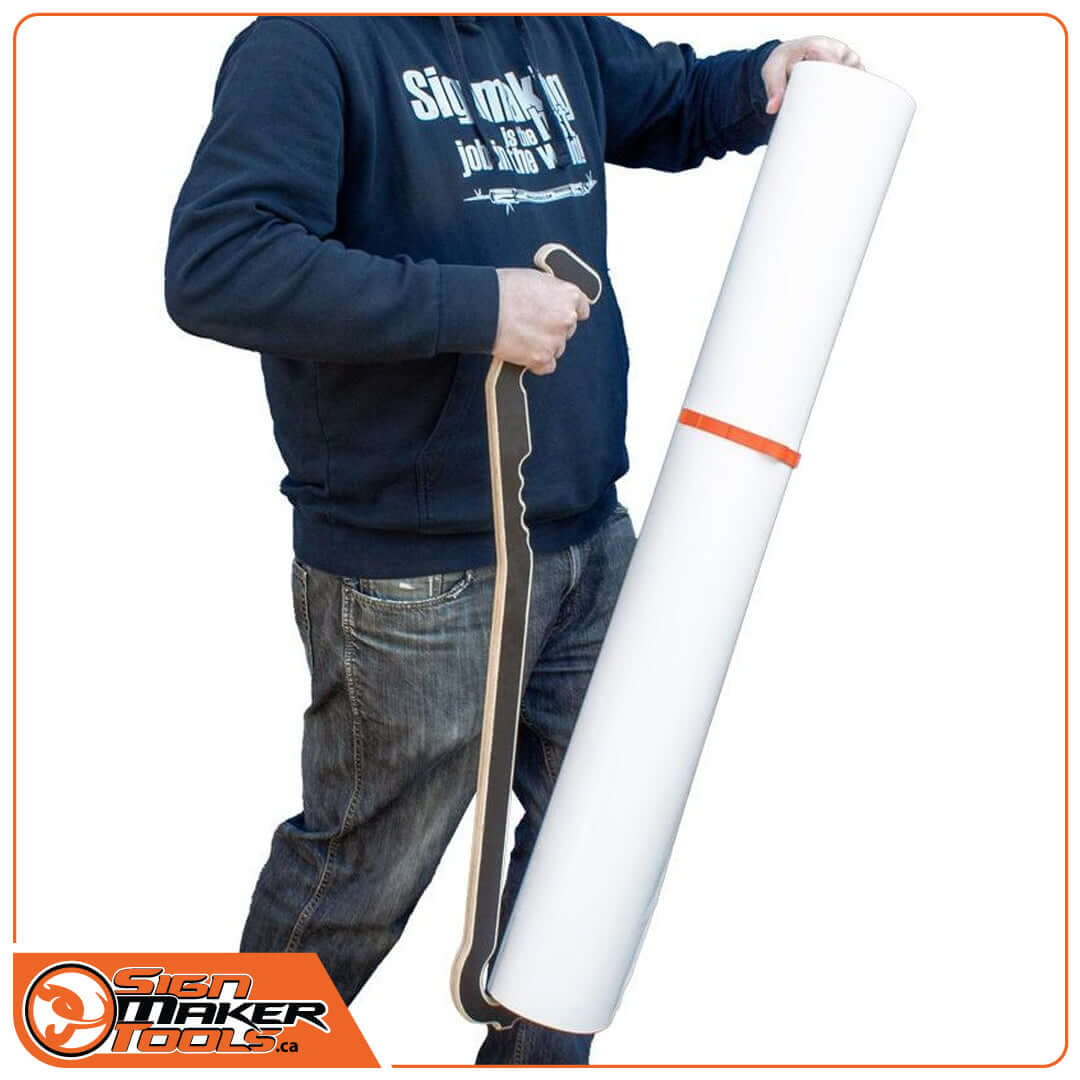 Person holding a vinyl roll vertically using the ergonomic TimStick tool